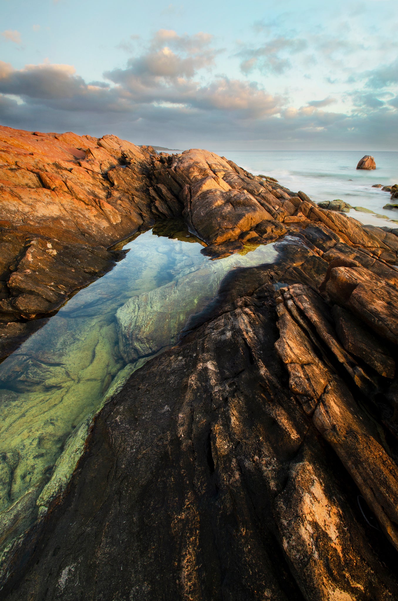 Sunrise light illuminating a rocky outcrop at Point Picquet.