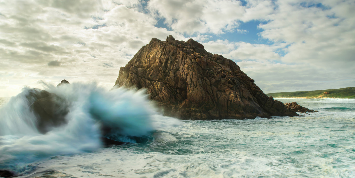 Crashing waves, showing no mercy towards anything in their path.