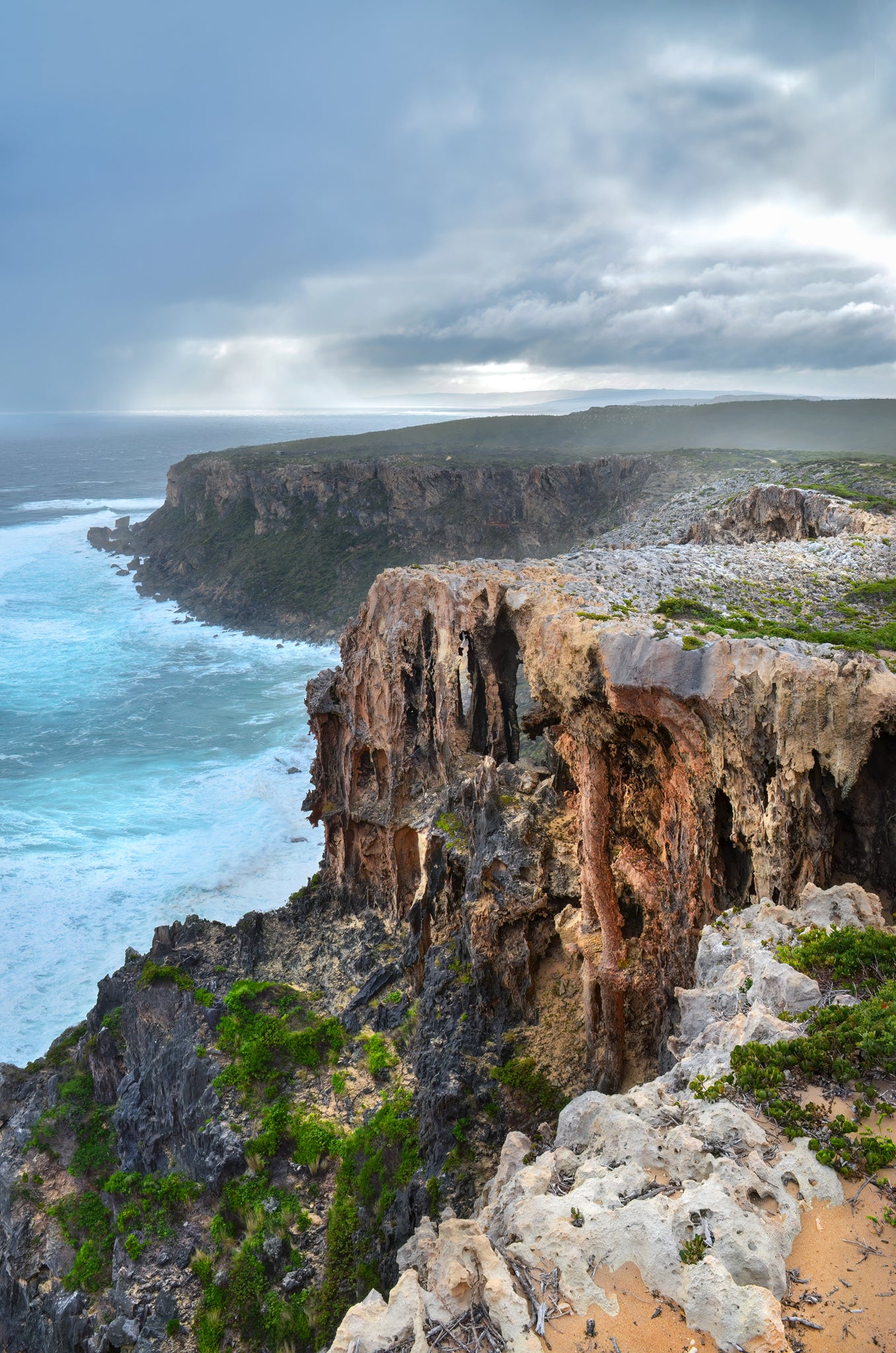 Moody storm clouds forming over Windy Harbour's dramatic headlands.