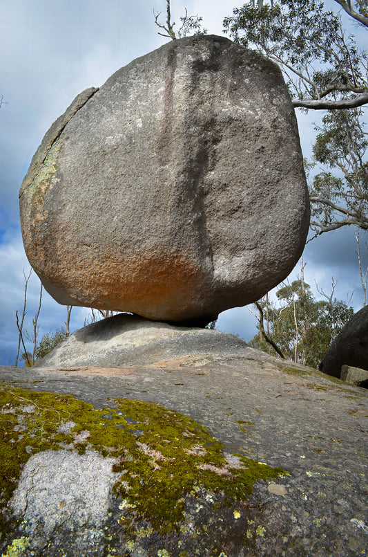 Defying gravity and precariously balanced boulder at Castle Rock, Albany.