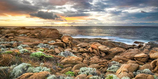 Rocks and coastal landscape with a sunrise sky