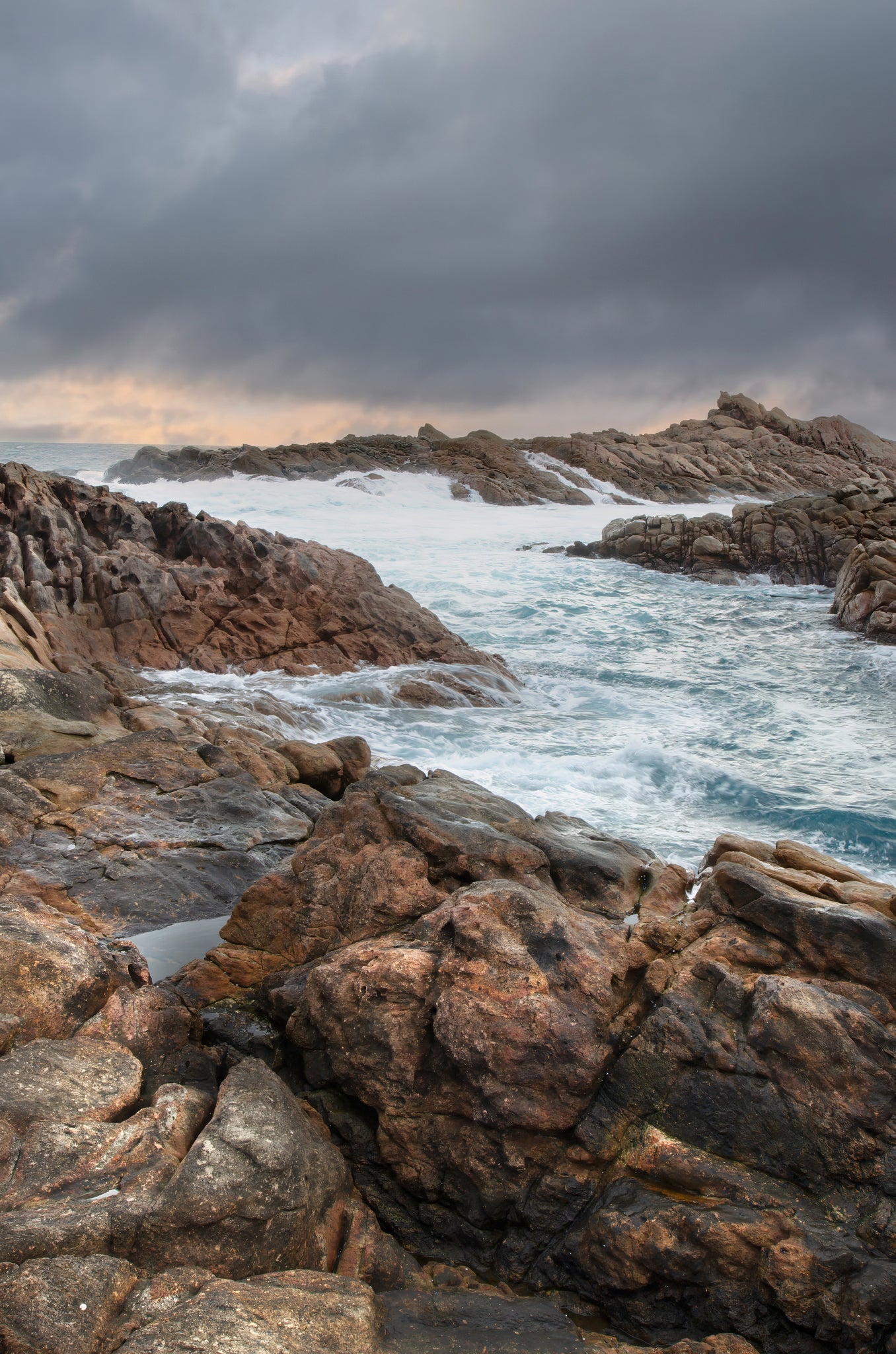Moody seascape of Canal Rocks under fast-moving storm clouds.