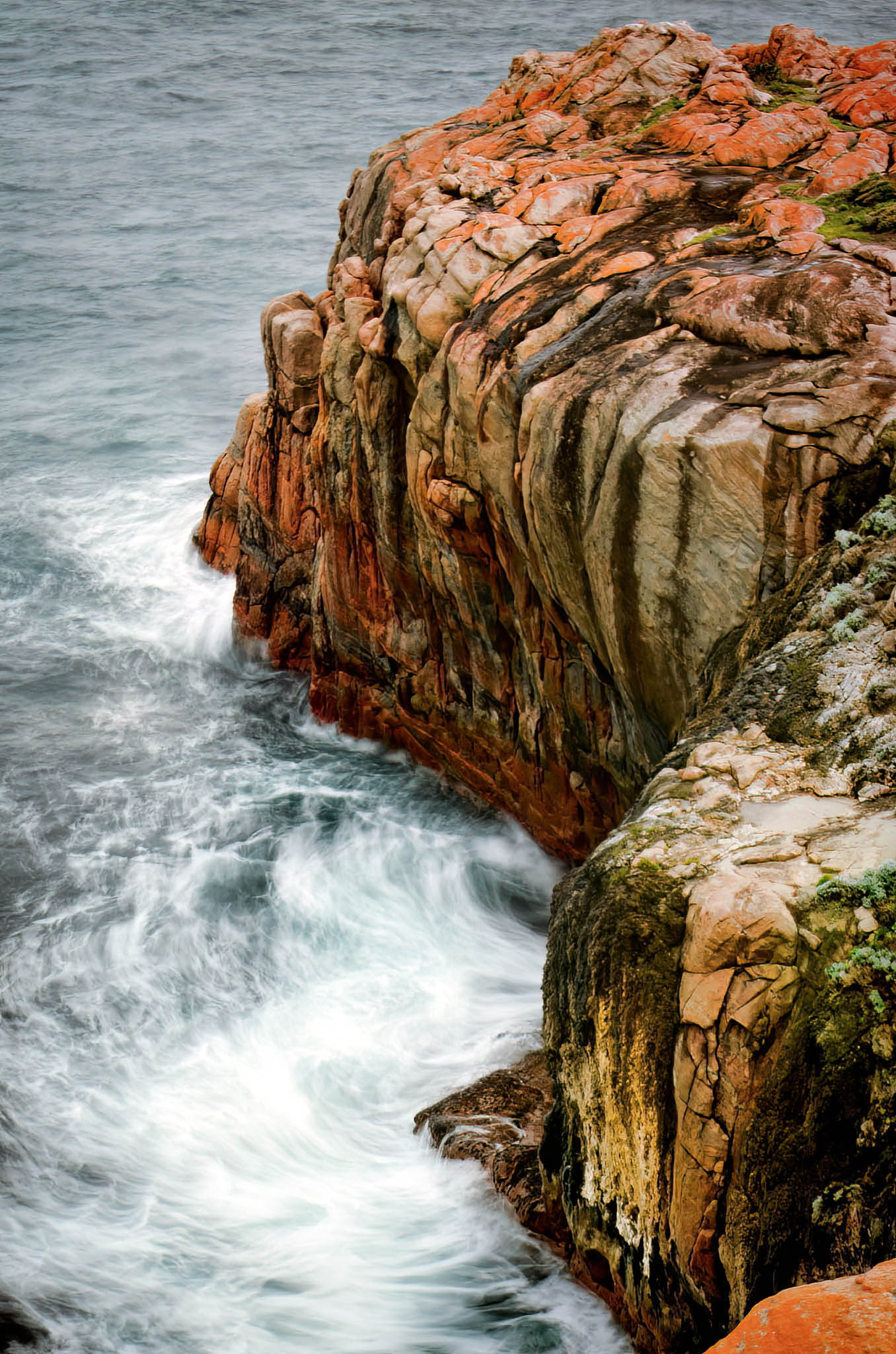 Rugged coastline with rocky cliffs and crashing waves