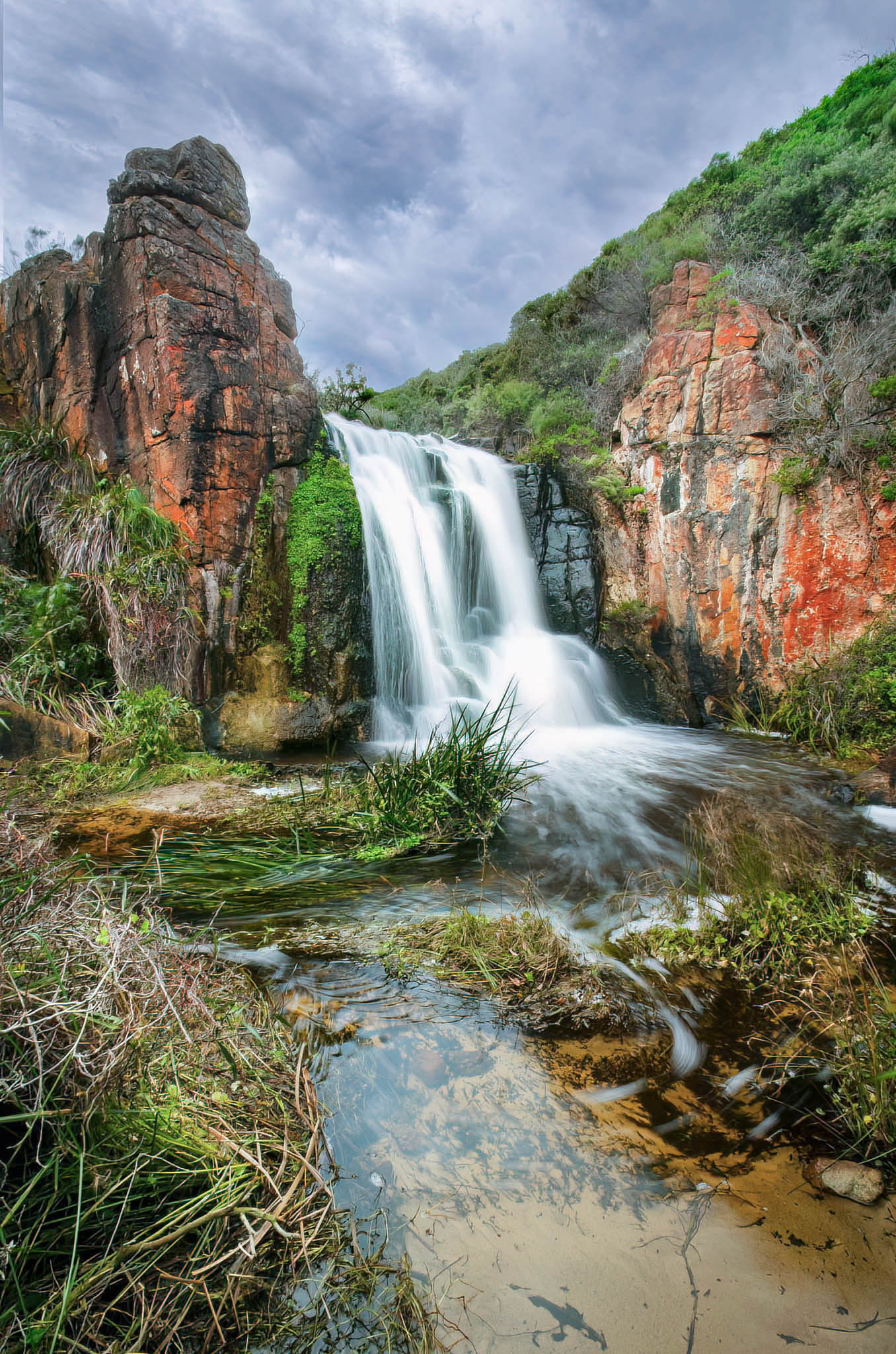 Long-exposure shot of Quinninup Falls with soft, silky water movement.