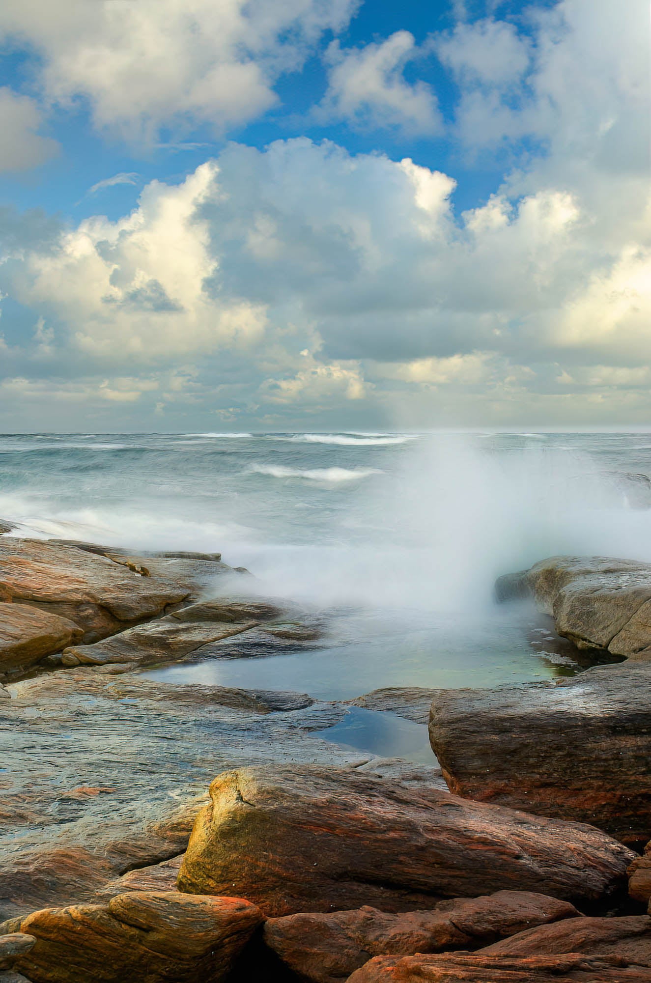 rocks seaspray redgate beach clouds rockpool southwest