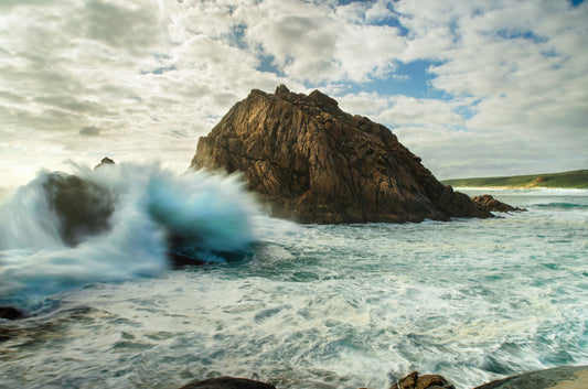 Crashing waves, showing no mercy towards anything in their path.