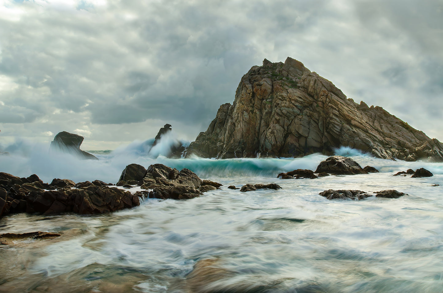 Dramatic, stormy seascape at Sugarloaf Rock on a winter day.