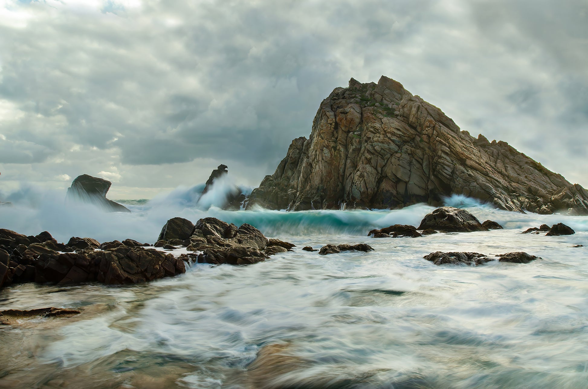 Dramatic, stormy seascape at Sugarloaf Rock on a winter day.