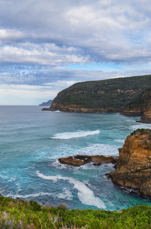 Dramatic coastal cliffs with turquoise Southern Ocean on the Tasman Peninsula.