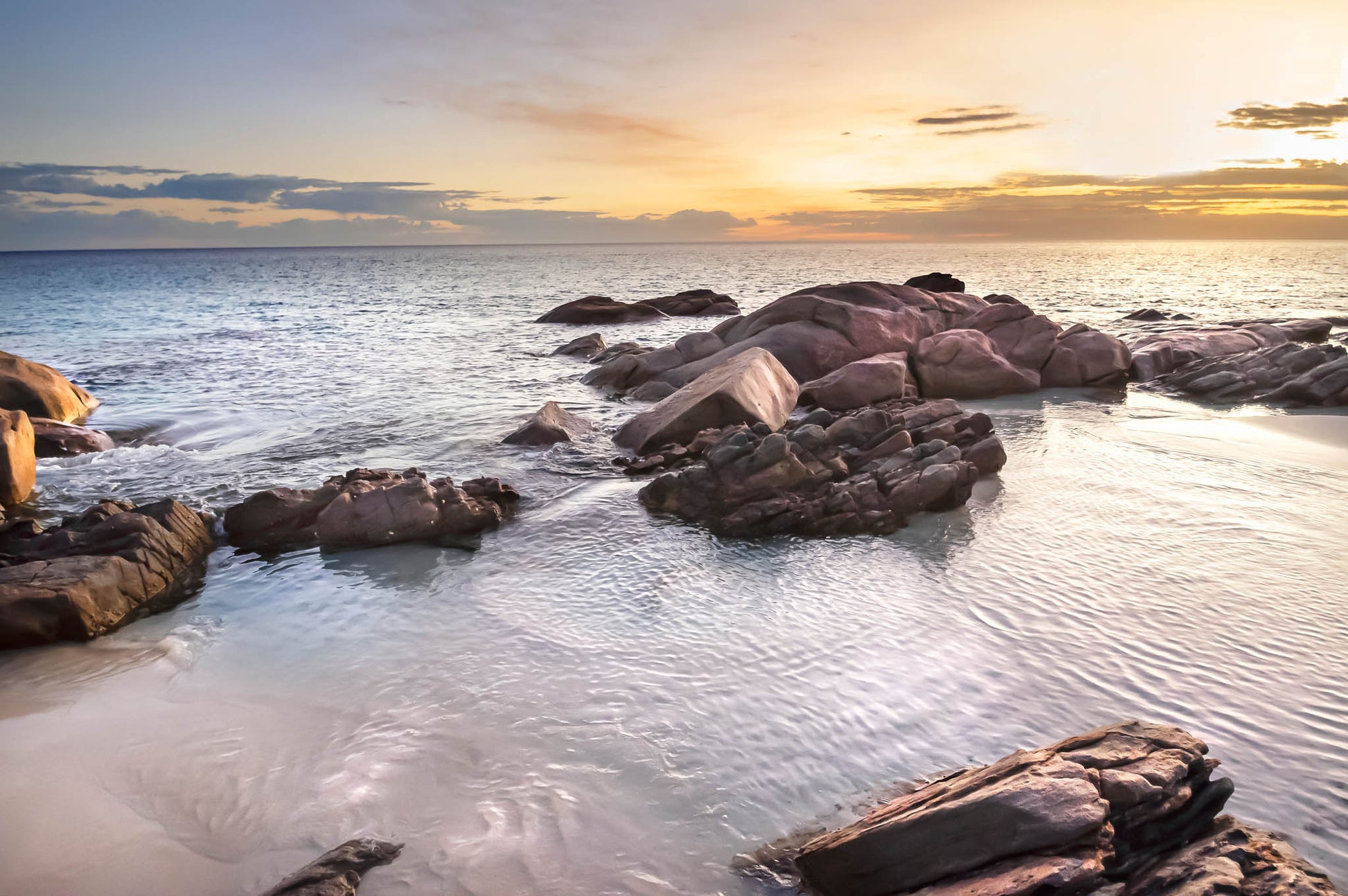 landscape photograph of a golden sunrise over point picquet